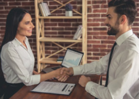 consultant and client shaking hands