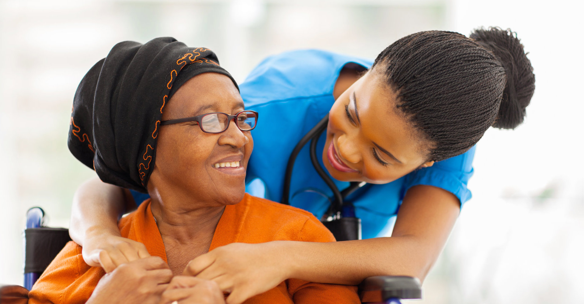 happy senior patient with friendly female nurse