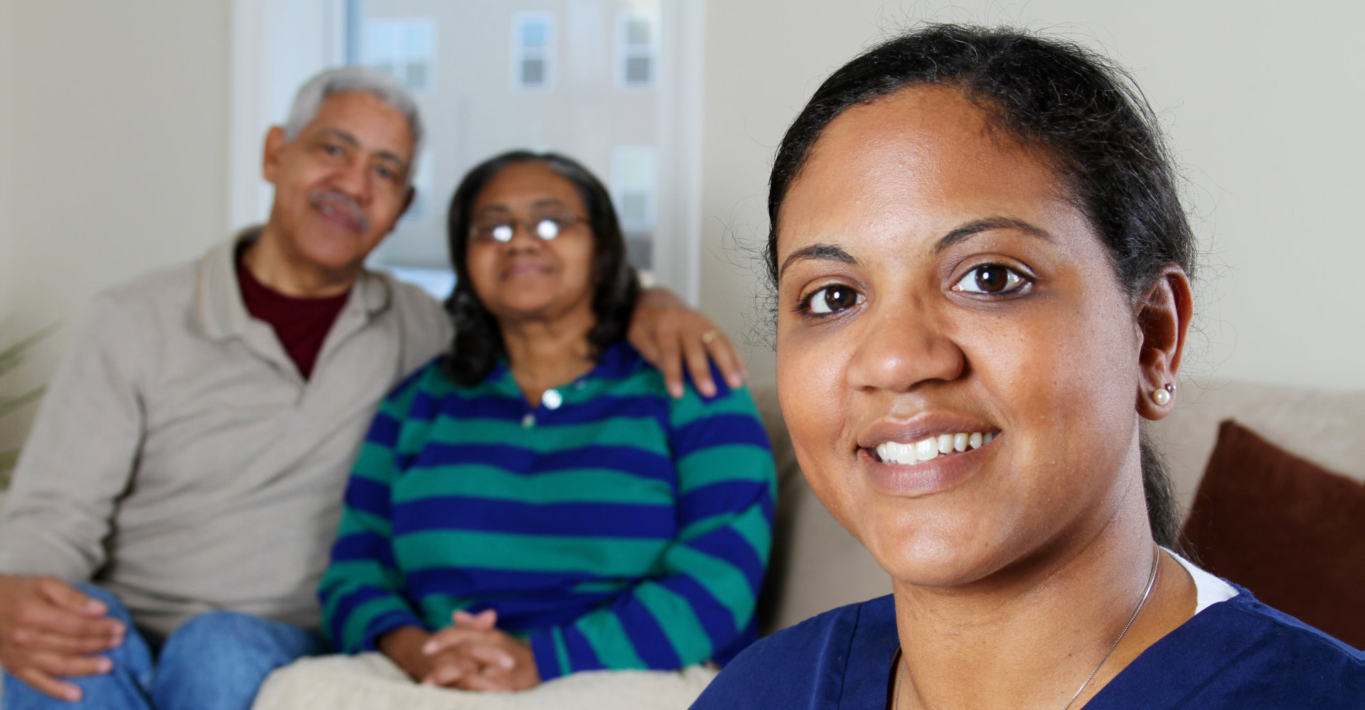 Home health care worker and an elderly couple